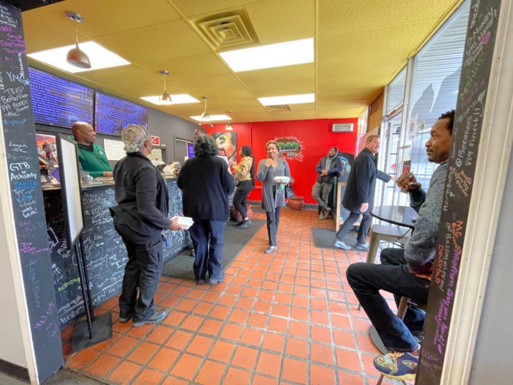 Customers gather at Trap Fusion's Whitehaven location on Friday, Jan. 17. The Greater Whitehaven Economic Redevelopment Corp. hosted its inaugural Whitehaven Business Blitz at the restaurant to celebrate commerce, economic development and community pride. (Julia Baker/The Daily Memphian)