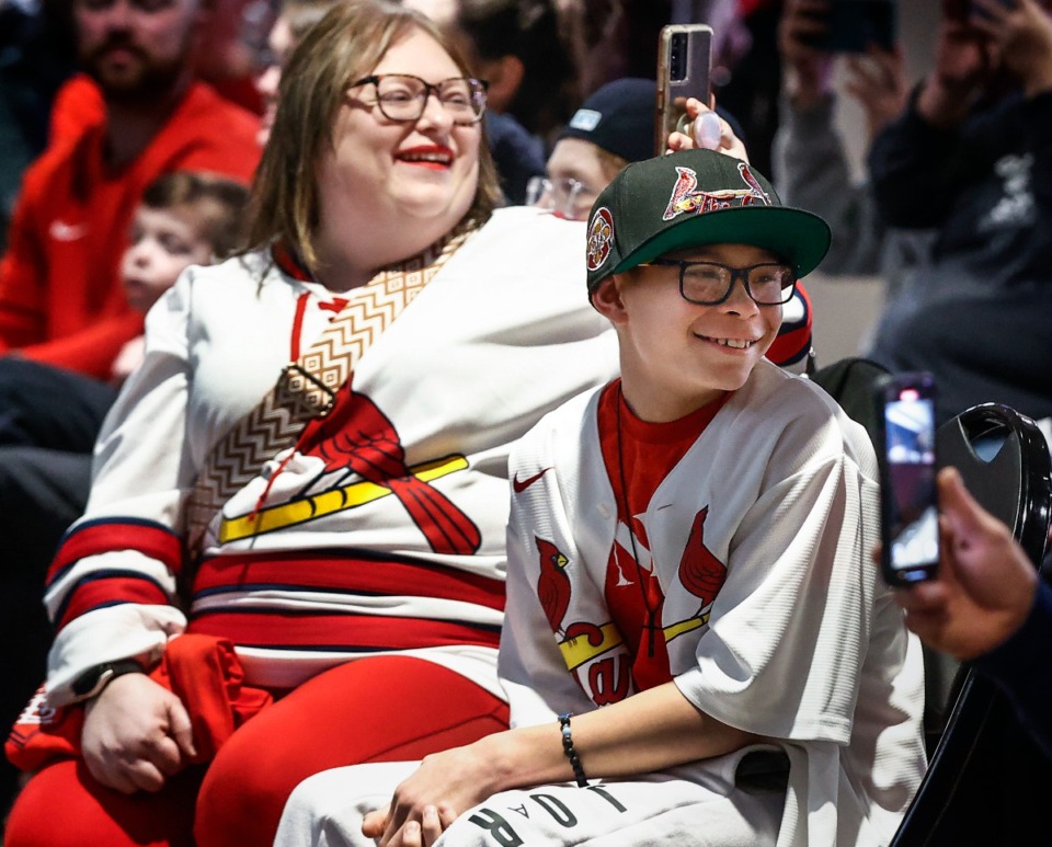 <strong>Louis Cardinals fans Pamela Reyes (left) and her son, Zander Reyes, 13, attend the Cardinals Caravan event Friday at AutoZone Park.</strong> (Mark Weber/The Daily Memphian)