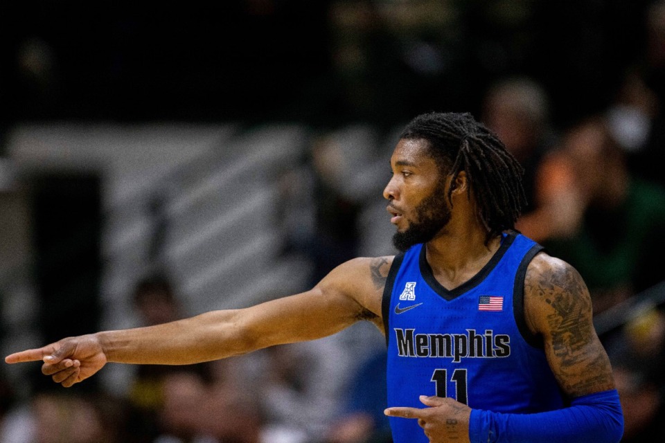 <strong>Memphis guard Tyrese Hunter (11) celebrates after a 3-pointer during Sunday&rsquo;s win at Charlotte.</strong> (Scott Kinser/AP Photo)