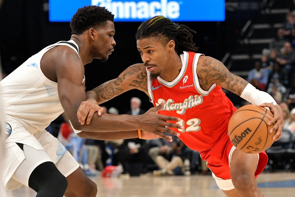 <strong>Memphis Grizzlies guard Ja Morant (12) handles the ball against Minnesota Timberwolves guard Anthony Edwards in the first half of an NBA basketball game Monday, Jan. 20, 2025, in Memphis.</strong> (Brandon Dill/AP)