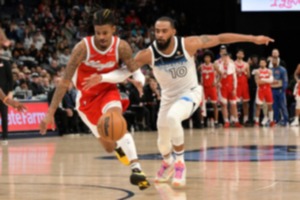 <strong>Minnesota Timberwolves guard Mike Conley (10) reaches for the ball against Memphis Grizzlies guard Ja Morant (12) in the first half of an NBA basketball game Monday, Jan. 20, 2025, in Memphis.</strong> (AP Photo/Brandon Dill)