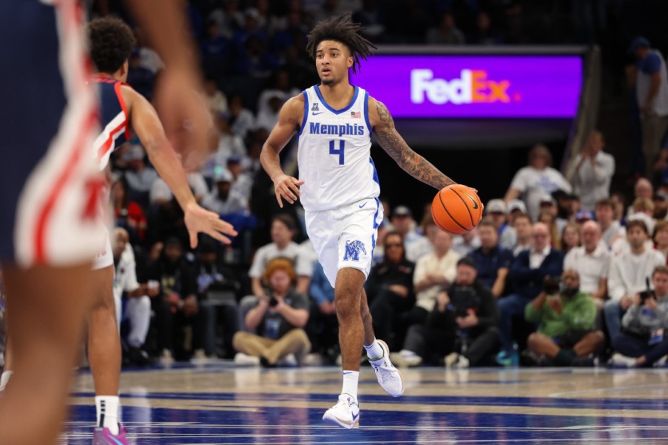 <strong>Memphis Tigers guard PJ Haggerty (4) drives to the basket against the Ole Miss Rebels during the second half at FedExForum on Saturday, Dec. 28, 2024.</strong> (Wes Hale/Special to The Daily Memphian)