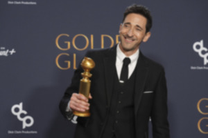 <strong>Adrien Brody poses in the press room with the award for best performance by a male actor in a motion picture &mdash; drama for "The Brutalist" during the 82nd Golden Globes on Sunday, Jan. 5, 2025, at the Beverly Hilton in Beverly Hills, Calif.</strong> (Chris Pizzello/AP file)