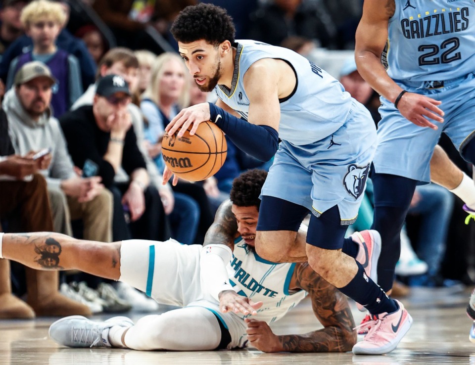 <strong>Memphis Grizzlies guard Scotty Pippen Jr. (middle) grabs a loose ball against the Charlotte Hornets on Wednesday, Jan. 22, 2025.</strong> (Mark Weber/The Daily Memphian)