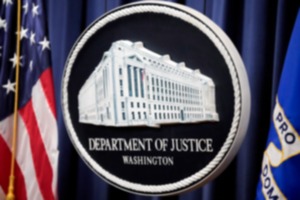 <strong>The logo for the Justice Department is seen before a news conference at the Department of Justice, Aug. 23, 2024, in Washington.</strong> (AP Photo/Mark Schiefelbein, File)