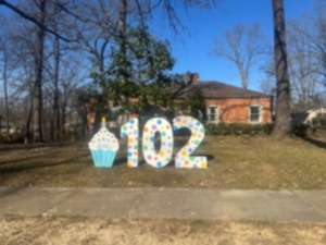 <strong>A giant cupcake and 102 in the yard of </strong><strong>T.K. Tanner. Tanner had a big party for his 100th birthday, but this year for his 102nd, the party was a neighborhood affair.</strong> (Geoff Calkins/The Daily Memphian)