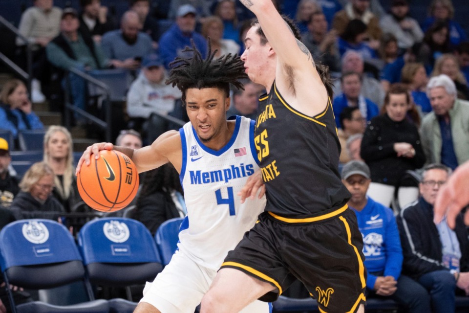 <strong>Memphis guard PJ Haggerty (4) drives to the basket against Wichita State guard Bijan Cortes (55) on Thursday, Jan. 23, 2025.</strong> (Nikki Boertman/AP)