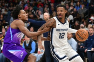 <strong>Memphis Grizzlies guard Ja Morant (12) handles the ball against Utah Jazz guard Collin Sexton in the second half of an NBA basketball game, Saturday, Jan. 25, 2025, at FedExForum.</strong> (Brandon Dill/AP)