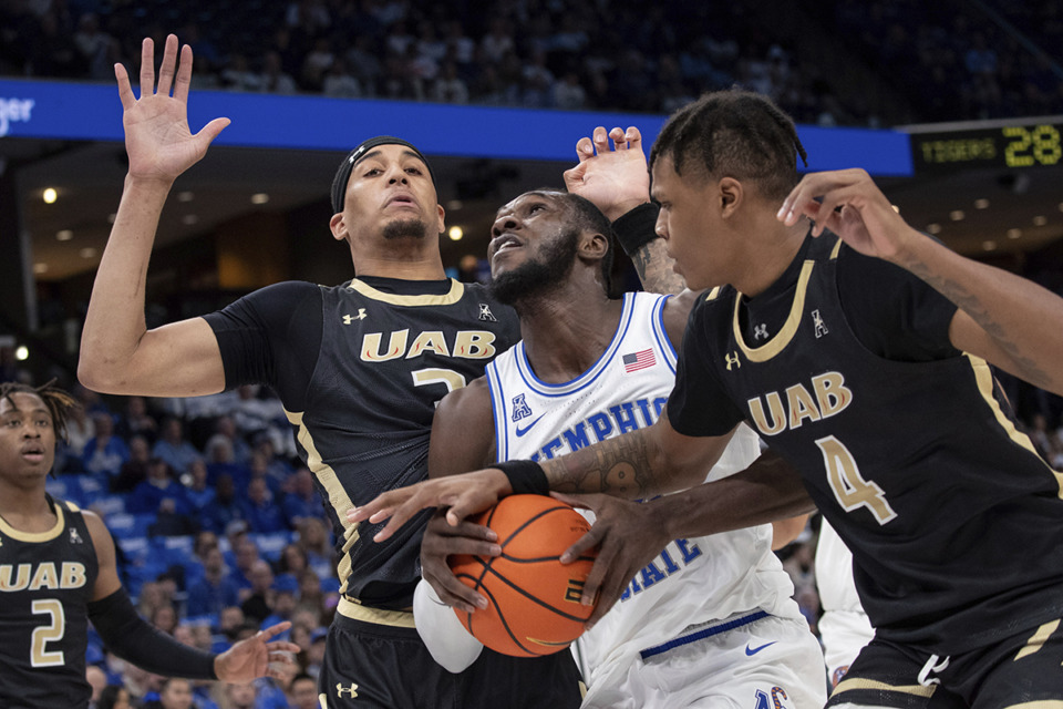 <strong>UAB forward Yaxel Lendeborg (3) and forward Christian Coleman (4) defend Memphis center Moussa Cisse, center, during the Tigers win over the Blazers, Sunday, Jan. 26, 2025, in Memphis.</strong> (Nikki Boertman/AP Photo)