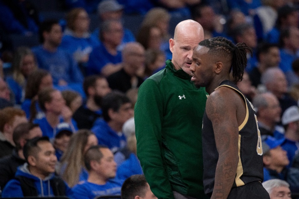 <strong>UAB coach Andy Kennedy, left, talks with Blazers guard Tony Toney, right, during Sunday&rsquo;s loss to Memphis.</strong> (Nikki Boertman/AP Photo)