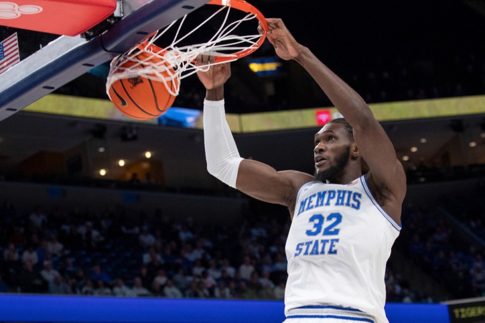 <strong>Memphis center Moussa Cisse (32) gets an uncontested dunk against UAB during the first half of an NCAA college basketball game Sunday, Jan. 26, 2025, in Memphis.</strong> (Nikki Boertman/AP)