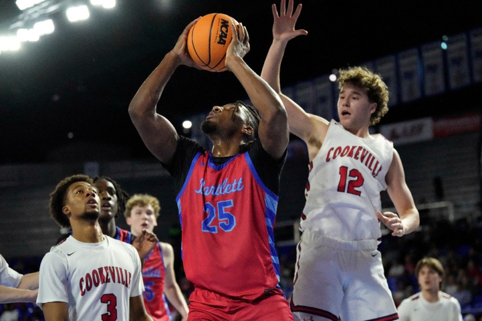 <strong>Bartlett forward R'chaun King (25) shoots as he is defended by Cookeville guard Jaren Davis (12) during the first half of a Class 4A basketball game Friday, March 15, 2024, in Murfreesboro, Tenn.</strong> (Mark Humphrey/Special to The Daily Memphian file)