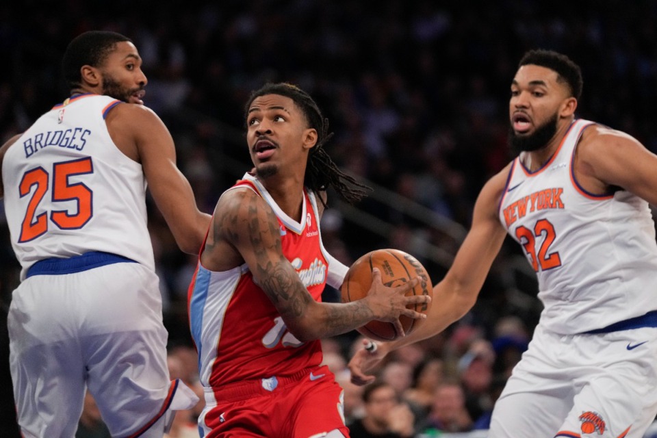 <strong>Memphis Grizzlies' Ja Morant, center, moves past New York Knicks' Mikal Bridges (25), left, and Karl-Anthony Towns during the first half of an NBA basketball game, Monday, Jan. 27, 2025, in New York.</strong> (AP Photo/Seth Wenig)