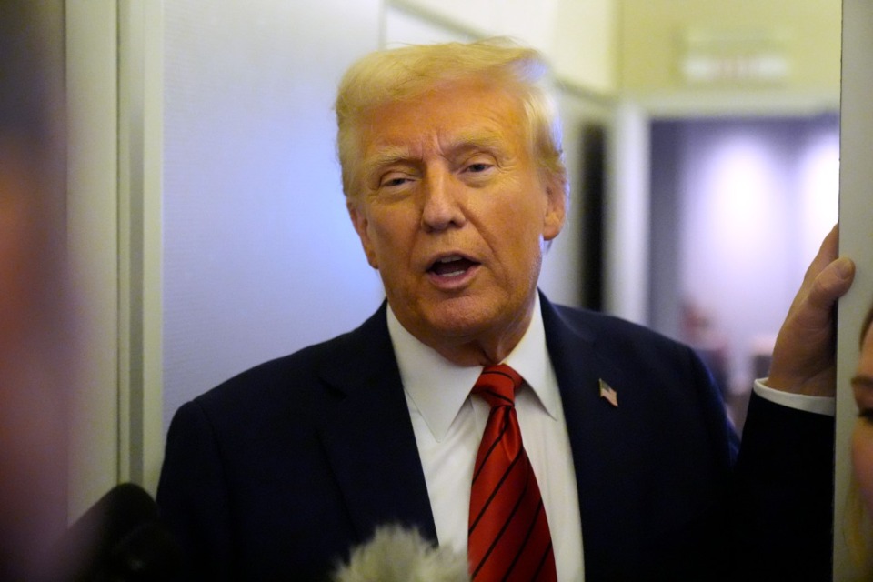 <strong>President Donald Trump speaks to reporters aboard Air Force One en route from Miami to Joint Base Andrews, Md., Monday, Jan. 27, 2025.</strong> (AP Photo/Mark Schiefelbein)