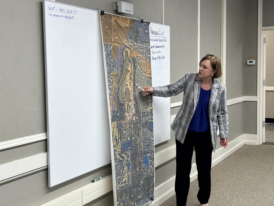 <strong>Molly Mehner, Collierville's town administrator, shows a map of a former landfill in the northern portion of the suburb to town leaders. They discussed purchasing the property Wednesday, Jan. 29.</strong> (Abigail Warren/The Daily Memphian)