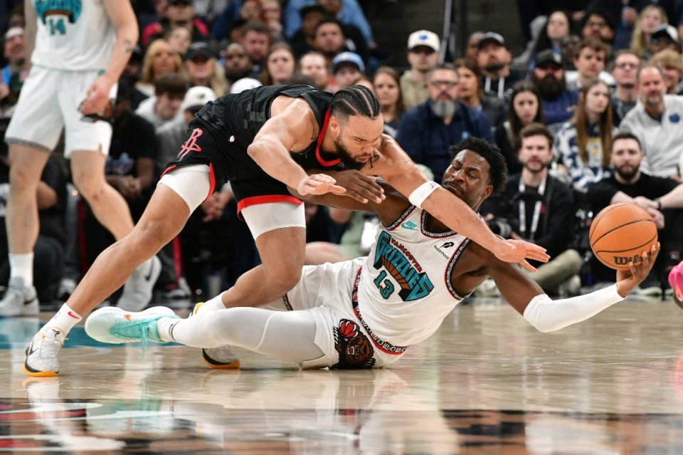 <strong>Memphis Grizzlies forward Jaren Jackson Jr. (13) and Houston Rockets forward Dillon Brooks struggle for control of the ball on Thursday, Jan. 30, 2025.</strong> (Brandon Dill/AP)