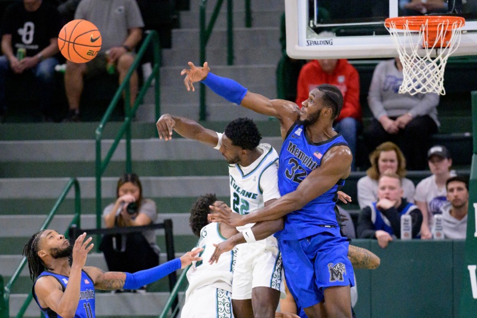 <strong>Memphis center Moussa Cisse (32) blocks a shot by Tulane guard Asher Woods (22) in the Tigers 68-56 win in New Orleans, Thursday, Jan. 30, 2025.</strong> (Matthew Hinton/AP)