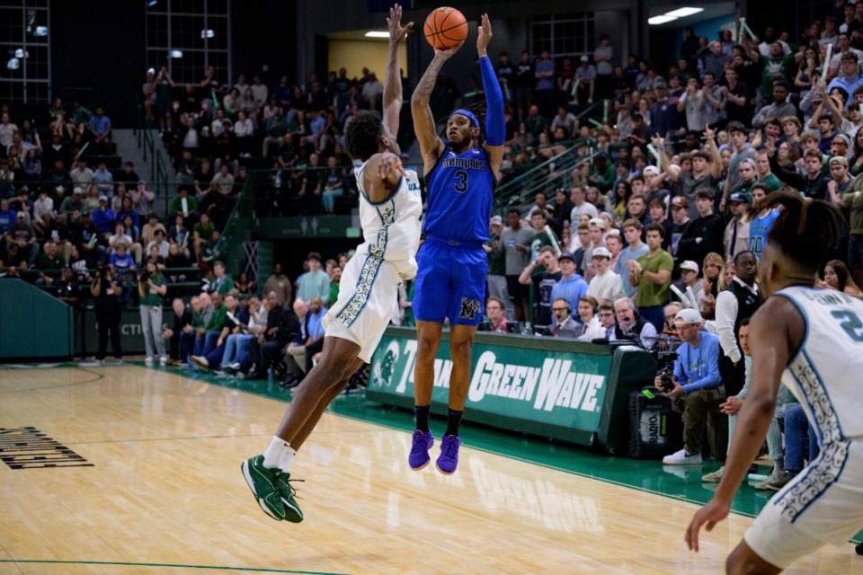 <strong>Memphis guard Colby Rogers (3) shoots a 3-pointer against Tulane forward Kaleb Banks (1) in New Orleans, Thursday, Jan. 30, 2025.</strong> (Matthew Hinton/AP)