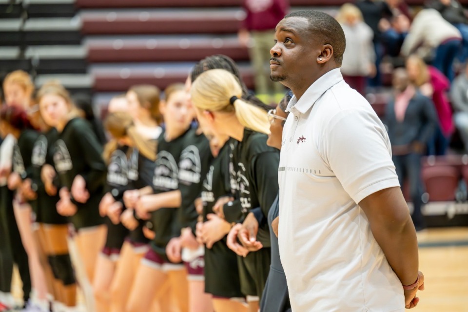 <strong>Collierville first-year girls basketball coach Kendrick Watkins stands with his team at the beginning of their home game against Cordova High on Jan. 24. Collierville defeated Cordova 55-13.</strong> (Greg Campbell/Special to The Daily Memphian)