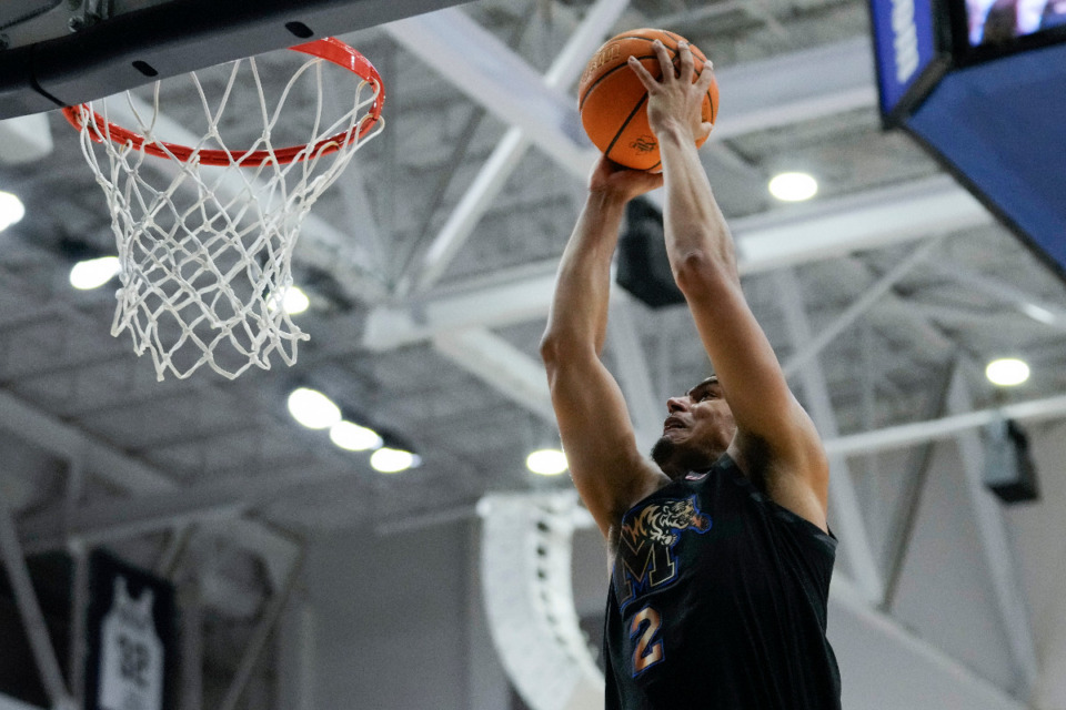 <strong>Memphis forward Nicholas Jourdain (2) dunks during the first half of an NCAA college basketball game against Rice in Houston, Sunday, Feb. 2, 2025.</strong> (AP Photo/Ashley Landis)