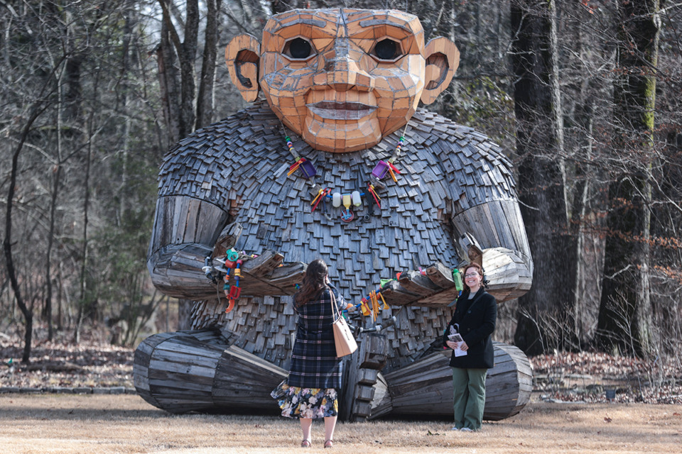 <strong>Visitors take pictures with Kamma, one of six Trolls that were installed at the Memphis Botanic Garden by artist Thomas Dambo, Jan. 31, 2025.</strong> (Patrick Lantrip/The Daily Memphian)