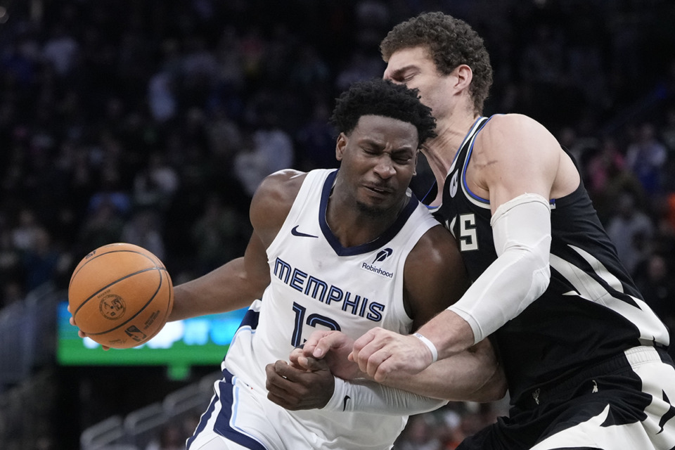 <strong>Memphis Grizzlies' Jaren Jackson Jr. tries to get past Milwaukee Bucks' Brook Lopez during the second half of an NBA basketball game Sunday, Feb. 2, 2025, in Milwaukee.</strong> (Morry Gash/AP Photo)