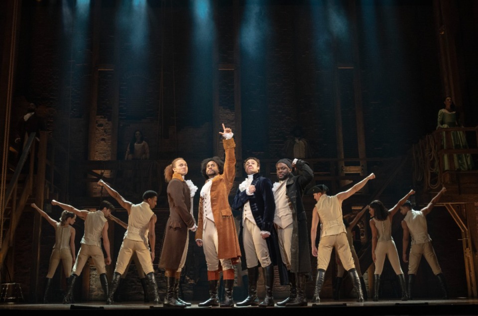 <strong>Nathan Haydel, far left, Tyler Fauntleroy, center left, Jared Howelton, center right, and Elvie Ellis, far right, perform a scene from &ldquo;Hamilton&rdquo; with the company.</strong> (Courtesy Joan Marcus/The Orpheum)