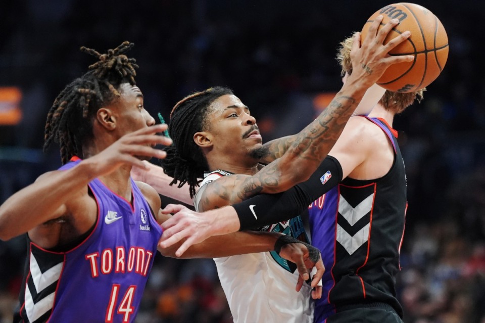 <strong>Memphis Grizzlies guard Ja Morant (middle) is fouled by Toronto&rsquo;s Gradey Dick (right) as Ja'Kobe Walter (14) defends on Wednesday, Feb. 5, 2025, in Toronto.</strong> (Frank Gunn/The Canadian Press via AP)