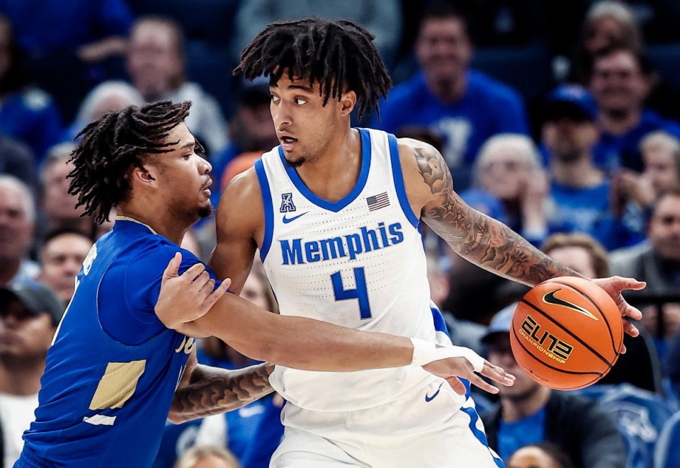 <strong>University of Memphis guard PJ Haggerty (right) looks to drive by Tulsa University defender Isaiah Barnes (left) during action on Tuesday, February 5, 2025.</strong> (Mark Weber/The Daily Memphian)