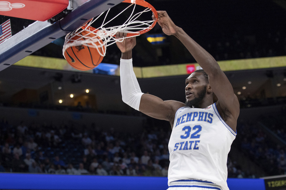 <strong>Memphis center Moussa Cisse (32) gets an uncontested dunk against UAB during the first half of an NCAA college basketball game Jan. 26.</strong> (Nikki Boertman/AP file)