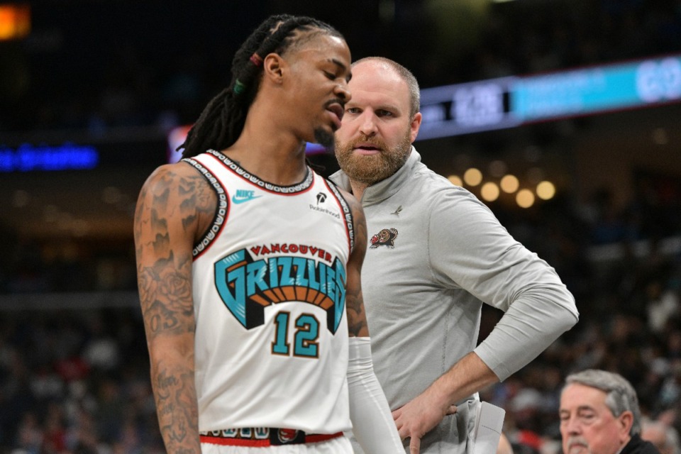 <strong>Memphis Grizzlies head coach Taylor Jenkins talks with guard Ja Morant (12) in the second half of an NBA basketball game against the Oklahoma City Thunder Saturday, Feb. 8, 2025, at FedExForum.</strong> (Brandon Dill/AP)