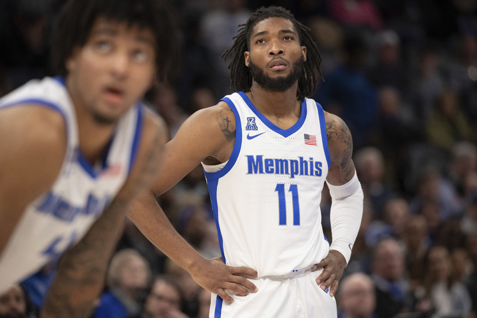 <strong>Memphis guards PJ Haggerty and Tyrese Hunter (11) watch a free throw during the second half of an NCAA college basketball game against East Carolina on Saturday, Jan. 11, 2025, in Memphis. Hunter is out &ldquo;day-to-day&rdquo; due to the same knee injury he has been dealing with this season, a team spokesman said.</strong> (Nikki Boertman/AP file)