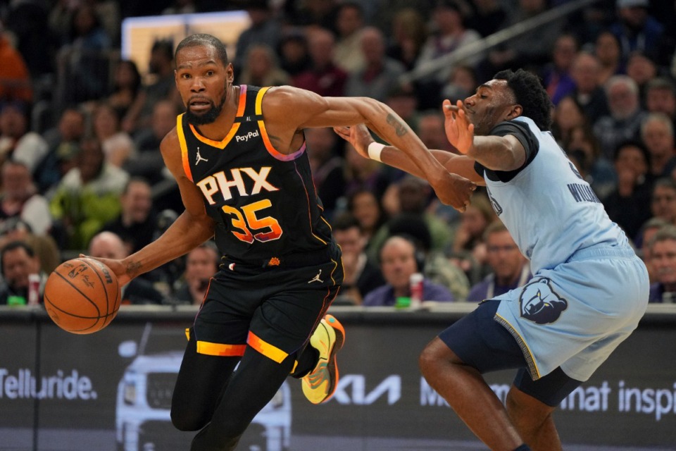 <strong>Memphis Grizzlies guard Vince Williams Jr. covers Phoenix Suns forward Kevin Durant (35) on Feb. 11, 2025, in Phoenix. Durant became the eighth NBA player to reach 30,000 career points.</strong> (Rick Scuteri/AP)