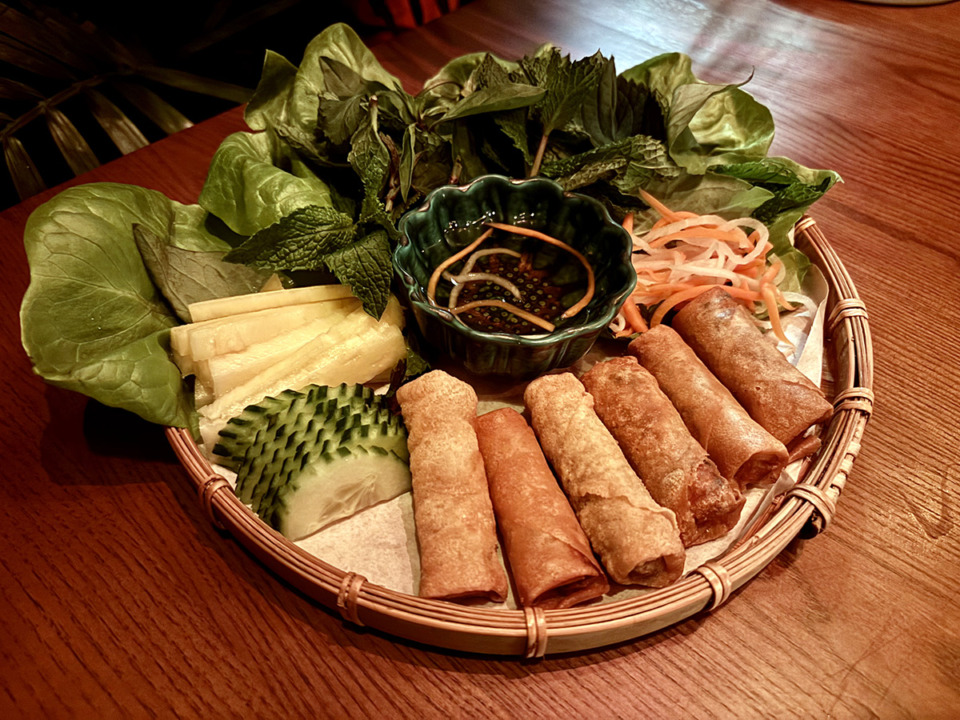 <strong>The cha gi&ograve; from Bao Toan in Crosstown Concourse are fried pork spring rolls with a setup of fresh basil, shiso, fish mint, cilantro, sliced pineapple, pickled carrots and daikon.</strong> (Joshua Carlucci/Special to The Daily Memphian)