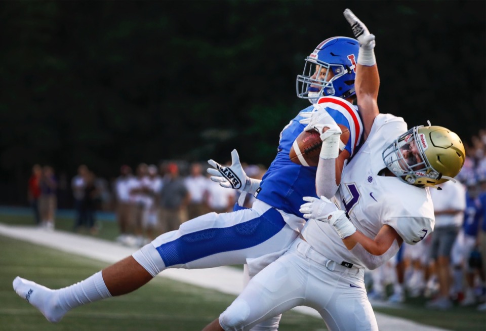 <strong>MUS receiver Gavin McKay (left) loses a shoe while making a touchdown catch against CBHS defender Braden Acuff in the game Friday, Sept. 5, 2019, at MUS. The Owls won, 37-24.</strong>&nbsp;(Mark Weber/Daily Memphian)