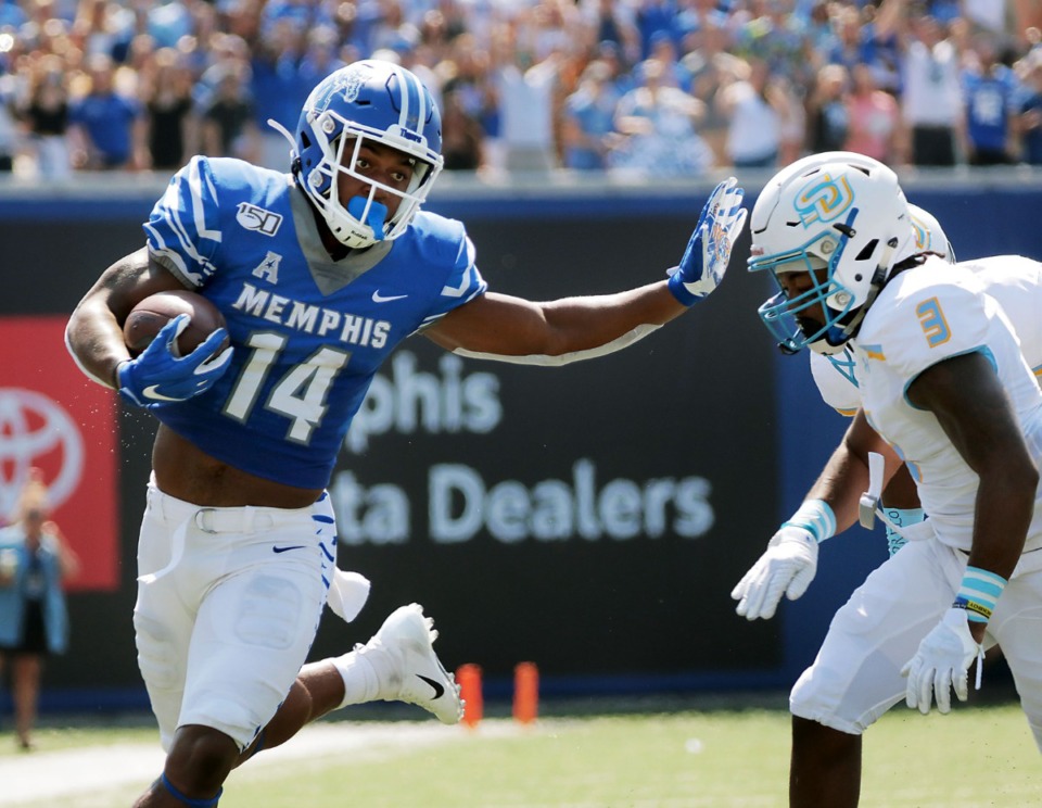 <strong>University of Memphis wide receiver Antonio Gibson (14) stiff-arms Southern University cornerback Elijah Small (3) on his way to a first-half touchdown at Liberty Bowl Memorial Stadium on Saturday, Sept. 7, 2019.</strong> (Patrick Lantrip/Daily Memphian)