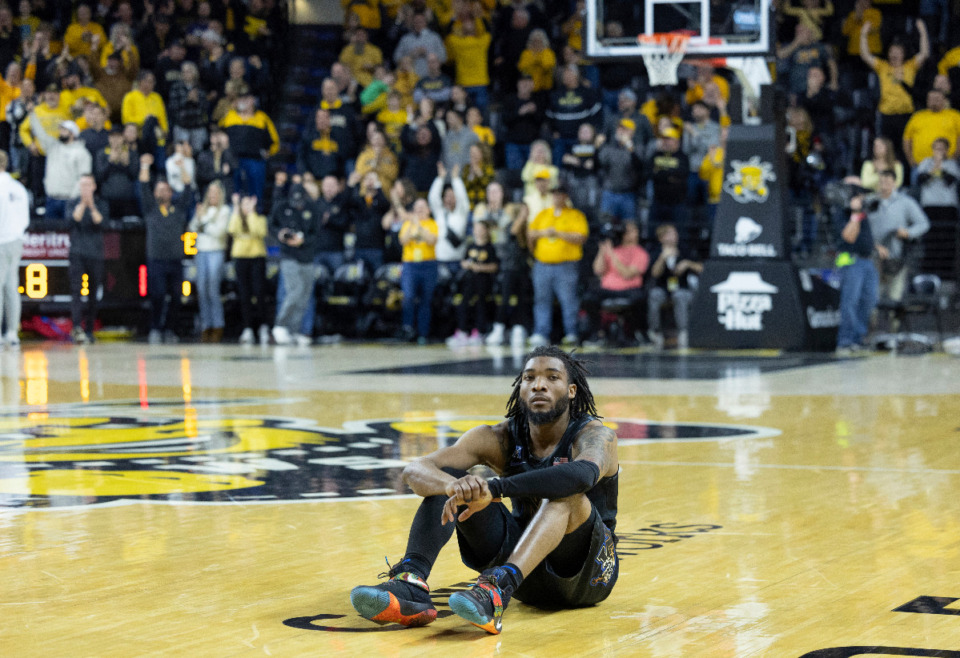 <strong>Memphis guard Tyrese Hunter sits on the court after his team lost to Wichita State in overtime of an NCAA college basketball game, Sunday, Feb. 16, 2025, in Wichita, Kan.</strong> (AP Photo/Travis Heying)