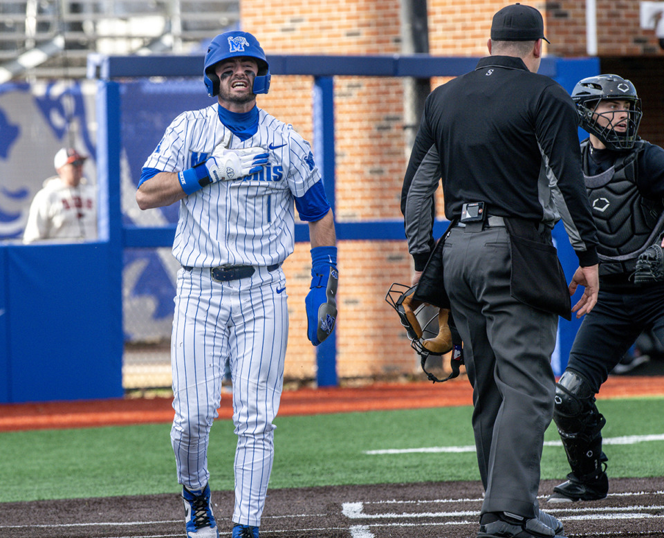 <strong>Memphis shortstop Creek Robertson celebrates after sliding safe into home plate in the fourth inning of the season opener against Southeast Missouri State. The Memphis Tigers defeated SEMO 4-1 in the first game of a double header.</strong> (Greg Campbell/Special for The Daily Memphian)