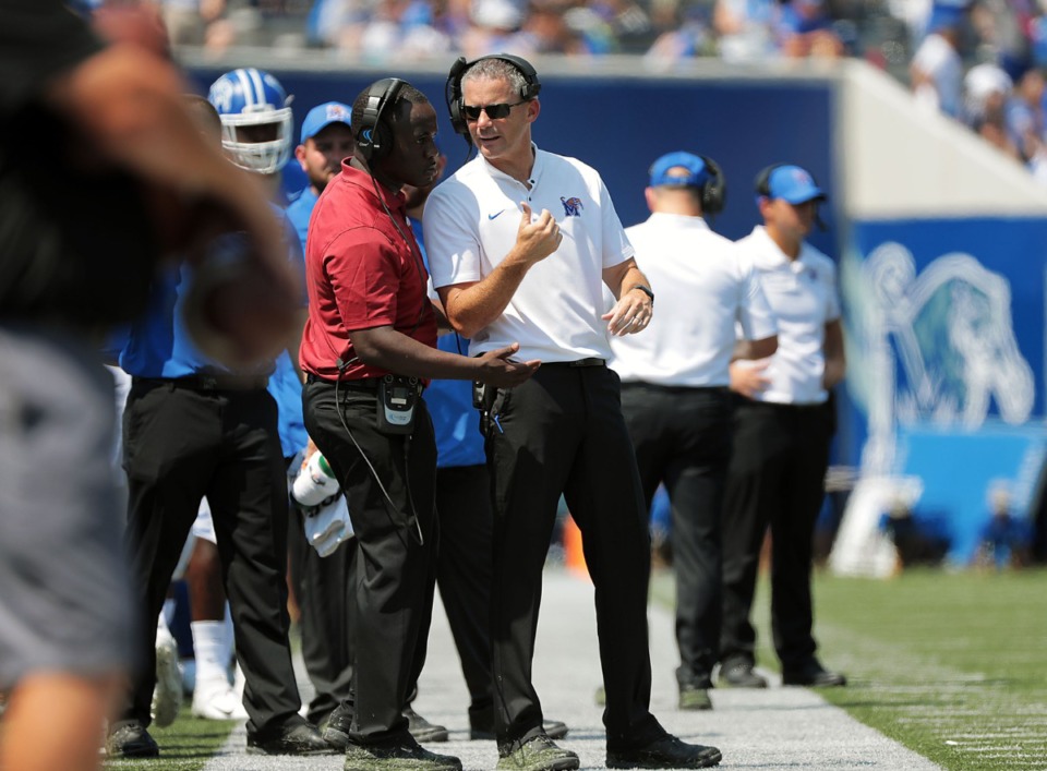 <strong>University of Memphis head coach Mike Norvell talks with an assistant during the second half of the Tigers' 55-24 victory over Southern University at the Liberty Bowl Saturday, Sept. 7, 2019.</strong> (Patrick Lantrip/Daily Memphian)