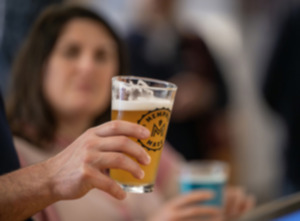 <strong>Heather Weileman of Baton Rouge, La., looks at her husband Michael's Memphis Made Brewing Co. pale ale in the Tap Room after the tour. Andy Ashby, co-owner, started tours for the brewery Feb. 8.</strong> (Greg Campbell/Special to The Daily Memphian)