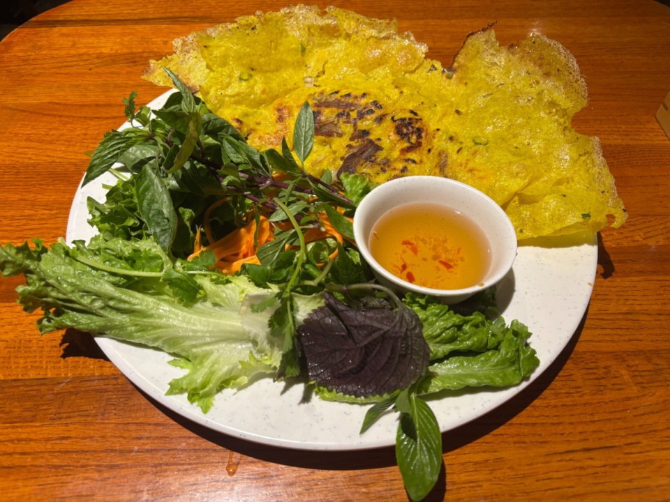 <strong>B&aacute;nh x&egrave;o, which translates to &ldquo;sizzling cake,&rdquo; gets its name from the way the batter crisps up in a hot pan, creating a delicate yet substantial crepe-like shell. Pho 4Ever&rsquo;s version stays true to the southern Vietnamese style. </strong>(Joshua Carlucci/Special to The Daily Memphian)