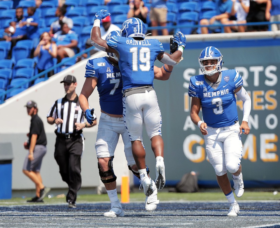 <strong>University of Memphis quarterback Brady White (3) rushes to congratulate teammate Kenneth Gainwell (19) after the latter scored a touchdown during the Tigers' 55-24 victory over Southern University at Liberty Bowl Memorial Stadium on Saturday, Sept. 7, 2019.</strong> (Patrick Lantrip/Daily Memphian)