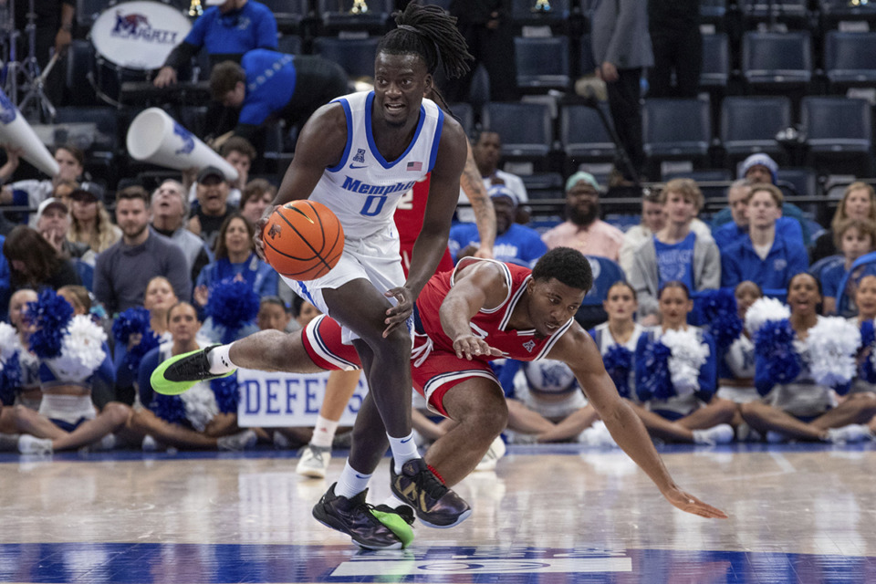 <strong>Memphis forward Damarien Yates (0) grabs a steal from Florida Atlantic guard Kyky Tandy, right, during the first half of an NCAA college basketball game Sunday, Feb. 23, 2025, in Memphis.</strong> (Nikki Boertman/AP Photo)