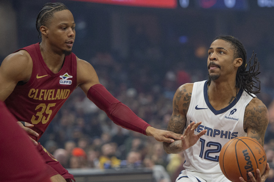 <strong>Memphis Grizzlies' Ja Morant (12) prepares to shoot as Cleveland Cavaliers' Isaac Okoro (35) defends during the first half of an NBA basketball game in Cleveland, Sunday, Feb. 23, 2025.</strong> (Phil Long/AP Photo)