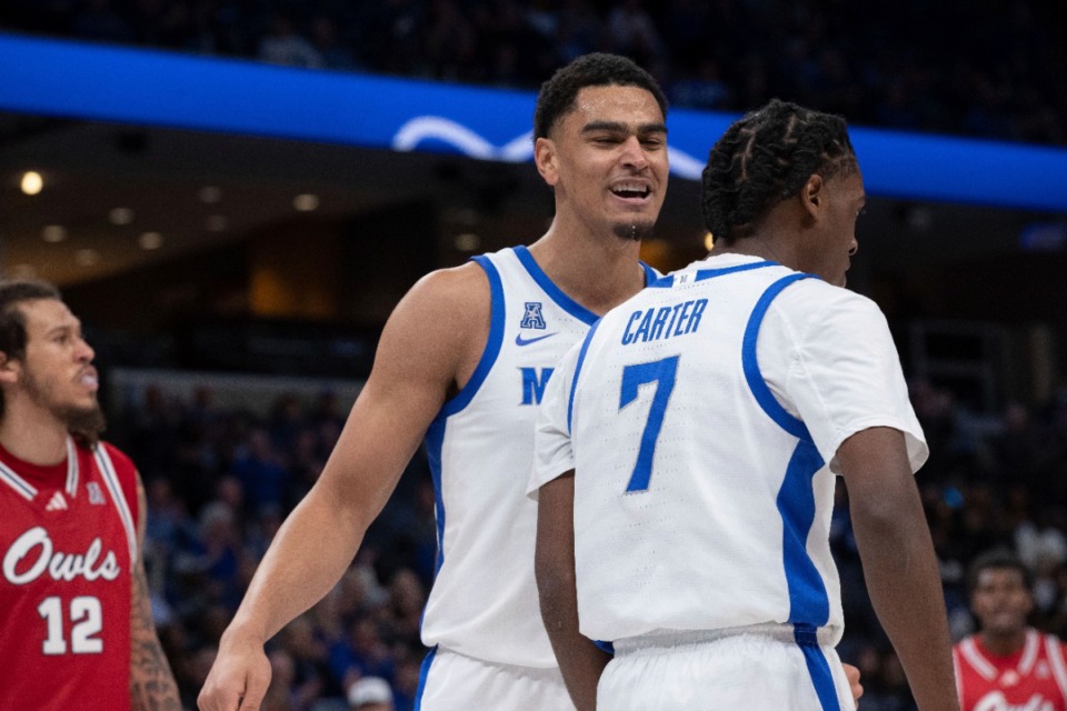 <strong>Memphis forward Nicholas Jourdain, center, celebrates with guard PJ Carter (7) during the first half of an NCAA college basketball game against Florida Atlantic, Sunday, Feb. 23, 2025, in Memphis.</strong> (Nikki Boertman/AP)