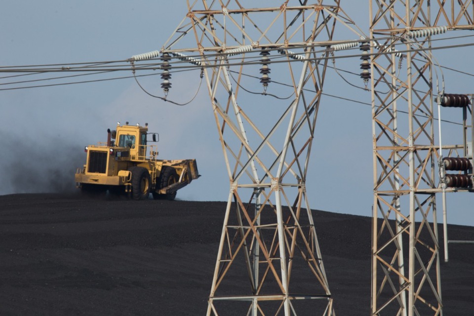 <strong>A bulldozer climbs the coal mound at TVA&rsquo;s Allen Fossil Plant.</strong> (The Daily Memphisn files)