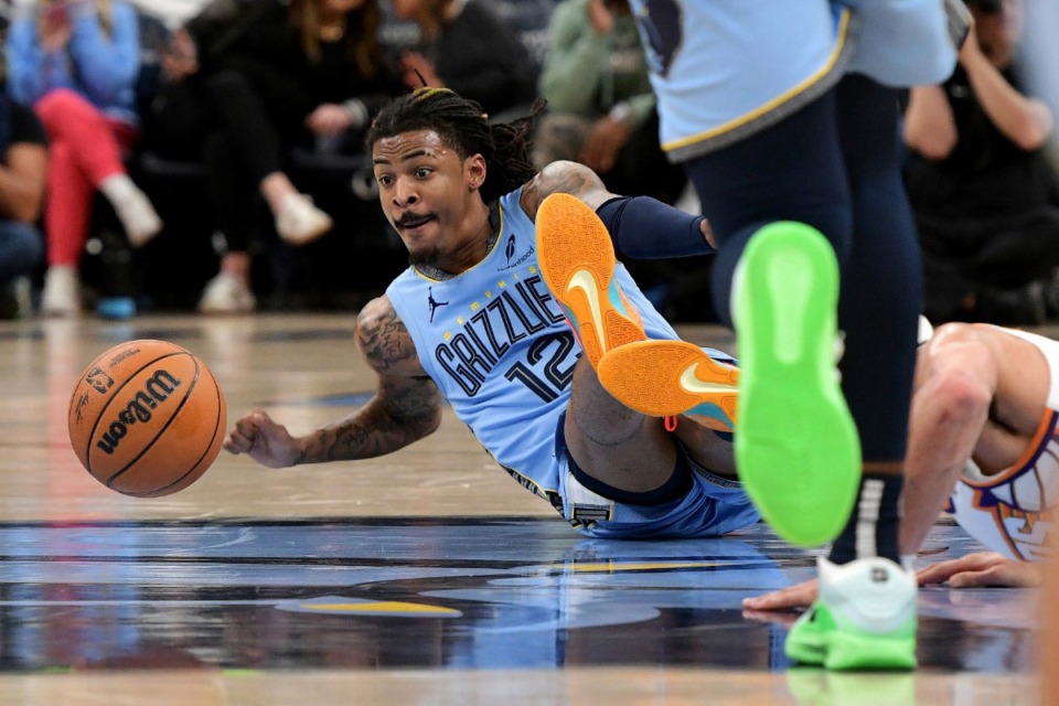 <strong>Memphis Grizzlies guard Ja Morant (12) reaches for the ball in the game against the Phoenix Suns Tuesday, Feb. 25, 2025.</strong> (Brandon Dill/AP)