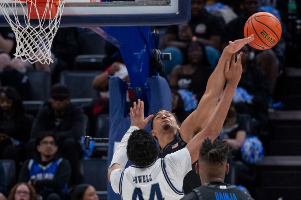 <strong>Memphis forward Nicholas Jourdain, center, blocks a shot by Rice forward Caden Powell on Wednesday, Feb. 26, 2025.</strong> (Nikki Boertman/AP)