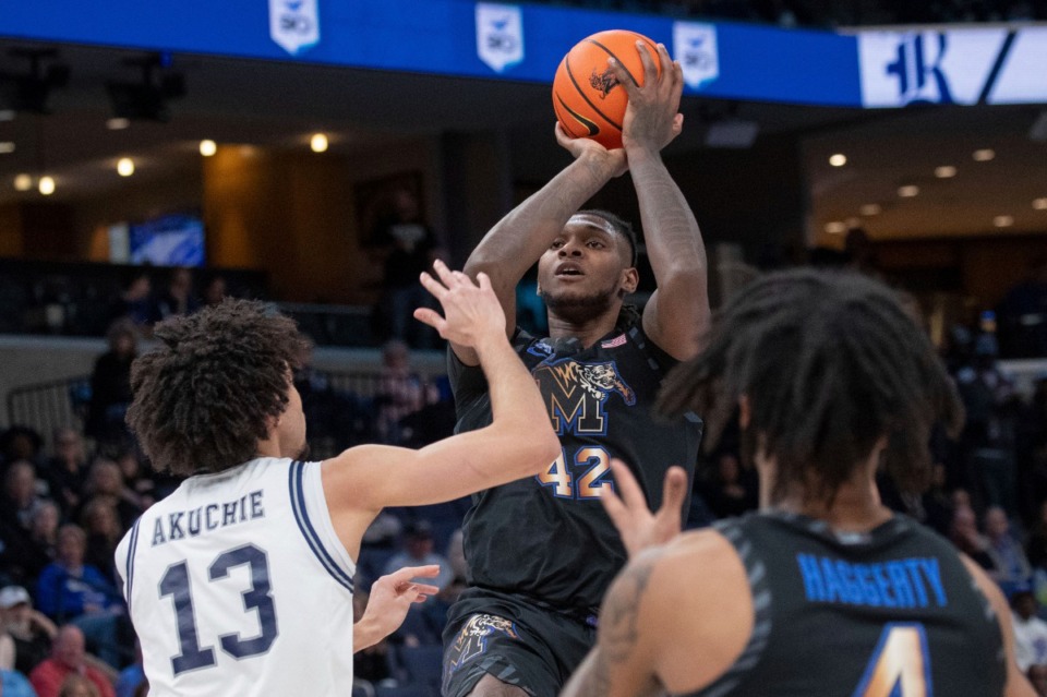 <strong>Memphis big man Dain Dainja (42) shoots over Rice forward Andrew Akuchie (13) on Wednesday, Feb. 26, 2025. Dainja scored 25 points and added 10 rebounds to lead the Tigers to the 84-72 victory.&nbsp;</strong> (Nikki Boertman/AP)