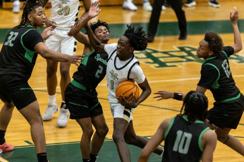 <strong>Whitehaven&rsquo;s Taquez Butler drives against White Station during Wednesday's District 16-4A championship game.</strong> (Brad Vest/Special to The Daily Memphian)